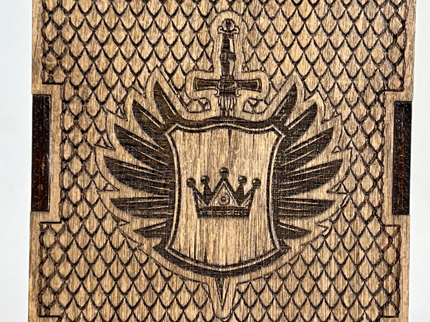 close up of shield and crown logo